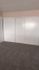 Carpeted bedroom with large closets