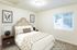 second bedroom with bed and side tables at fairview court