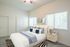virtually staged bedroom with full bed with decorative pillows