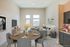 virtually staged living room with beige sofa and two grey chairs at rogers landing