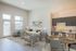 virtually staged living room with beige sofa and two grey chairs at rogers landing