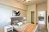 virtually staged bedroom with full bed with decorative pillows