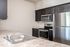 Kitchen at Alderbrook with stainless steel appliances and a breakfast bar