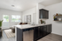 Virtually staged image of kitchen and living room at Alderbrook in Vancouver, WA