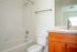 bathroom with shower and tub combo