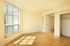 bedroom with hardwood flooring and large windows and closet with sliding doors