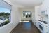kitchen with white appliances and cabinetry at cassi