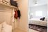 bedroom with walk in closet and bed in the background