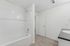 Bathroom with wood-style flooring and a shower/tub combo