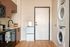 Fully Furnished One-Bedroom, One-Bathroom Floor Plan Kitchen and in-home washer & dryer