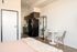 Fully Furnished Studio Floor Plan bed, kitchen, and living area