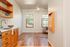 Kitchen and living area with original hardwood floors at Fairmont in Portland, OR
