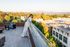 woman on rooftop deck near dusk