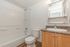 bathroom with shower tub combo