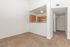 carpeted dining area and kitchen with breakfast bar