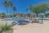 pool with picnic table and chairs and trees around