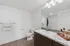 bathroom with vanity and tub shower combo