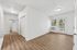 living room with hallway that has closets