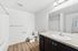 bathroom with sink, toilet, and shower tub combo