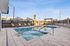 pool and hot tub with lounge area at asa apartments