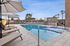 pool and hot tub with lounge area at asa apartments