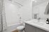 guest bathroom with tub and shower