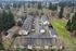 Aerial drone shot of property and surrounding area showing woodland with lots of trees