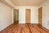 Bedroom with wooden floors.