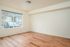 Ground floor bedroom with view of parking lot.