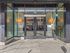Main glass entrance to Koz on N. Killingsworth apartment community.