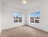 Sun-drenched bedroom with dual windows at Koz on N. Killingsworth.