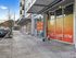 Street-level view of the modern exterior and leasing office at Koz on 4th.