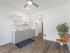Open-concept studio layout featuring a modern kitchen at Koz on 4th.