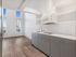 Sleek kitchen with grey cabinetry and mountain views at Koz on 4th.