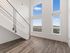 Loft apartment featuring vaulted ceilings and tall windows at Koz on 4th.