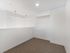 Carpeted loft mezzanine with bright recessed lighting at Koz on 4th.