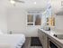 Modern kitchen featuring white quartz countertops at Koz on 13th.