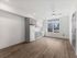Modern studio apartment with ceiling fan at Koz on 13th.