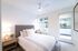 Bedroom with balcony and ceiling fan