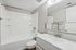 Bathroom with view of shower, bath, toilet, and sink