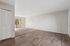 Living area with wooded floors and carpet and patio