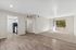 Living area with wood floors, carpet, patio, fridge, oven, and closet