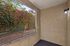 Ground floor balcony with lamp and bushes