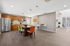 Shared communal area with kitchen and dining table and chairs