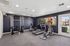 Fitness center with treadmill, elliptical, cable gym, and exercise bike