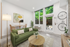 artisan living room virtual staging with couch, bike rack and windows