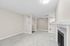 angle 3 of living room of C1 renovated floorplan at Timber Flats showing front door and dining room