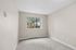 bedroom 1 in C1 renovated floorplan at Timber Flats window and carpet