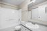 bathroom in C1 renovated floorplan at Timber Flats shower/tub toilet and sink grey countertops