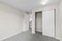 bedroom 2 with closet view in B1 renovated floorplan at Timber Flats windows and carpeted